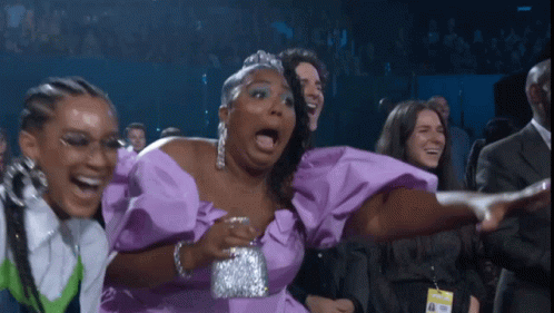 Woman in Purple Dress Laughing with Mouth Open