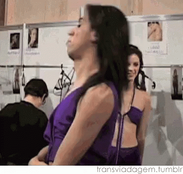 Woman In Purple Dress Next To Woman In Bikini GIF