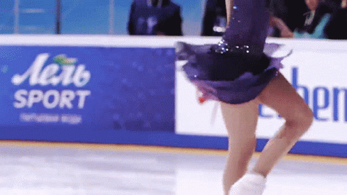 Woman In Purple Dress Skating In Front Of Aerb Sport Sign GIF