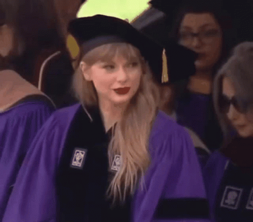 Woman in Purple Graduation Cap and Gown
