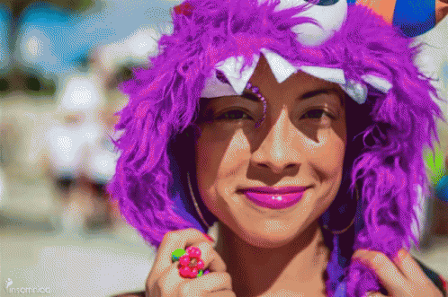 Woman In Purple Horned Hat With Flower Ring GIF
