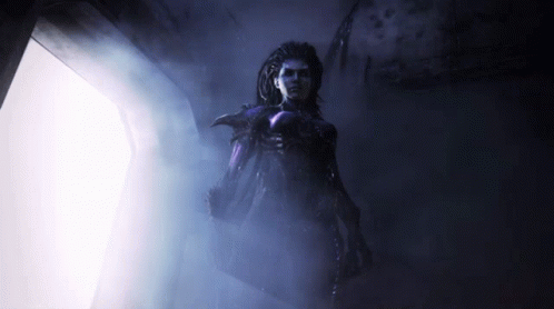 Woman in Purple in Dark Hallway