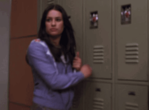 Woman In Purple Jacket Holding Knife And Red Cup With M GIF