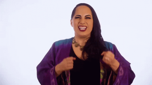 Woman In Purple Jacket Making Funny Face GIF