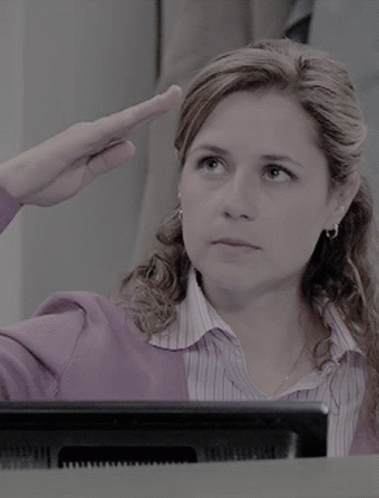 Woman in Purple Saluting at Computer