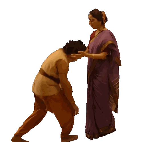 Woman in Purple Sari Kneeling Next to Man
