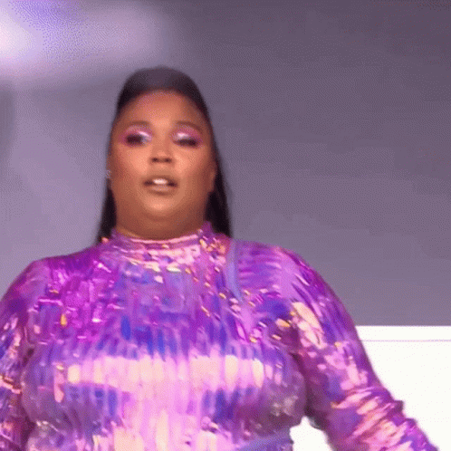 Woman in Purple Sequined Dress on Stage