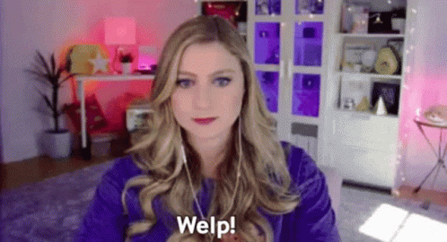 Woman in Purple Shirt on Video Call With Headphones