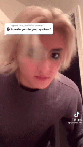Woman in Purple Shirt Questioning Eyeliner
