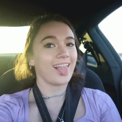 Woman in Purple Shirt Sticking Out Tongue