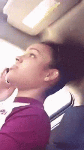 Woman In Purple Shirt Talking On Phone GIF