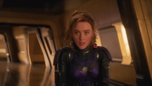 Woman in Purple Suit Standing in Doorway