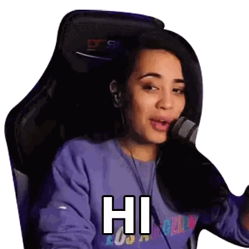 Woman in Purple Sweater Saying Hi