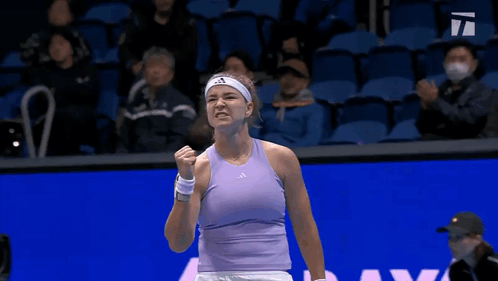 Woman in Purple Tank Top Fist Pump Tennis