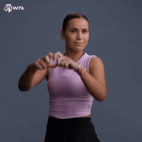 Woman in Purple Tank Top Making Heart Shape