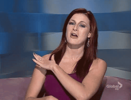 Woman In Purple Tank Top On Pink Couch GIF