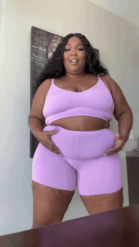 Woman in Purple Top and Shorts