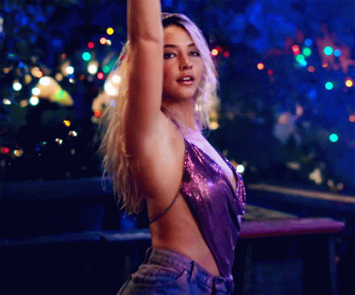 Woman in Purple Top Dancing
