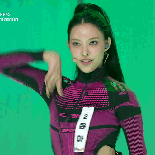Woman In Purple Top With Number 2 GIF