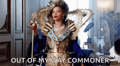 Woman in Queen Costume Holding Crown Says Out of My Way Commoner