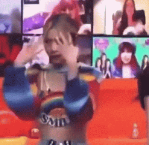 Woman in Rainbow Top Making Funny Face at Screen