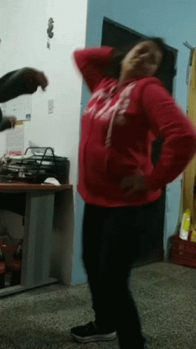 Woman in Red Abercrombie Sweatshirt Dancing