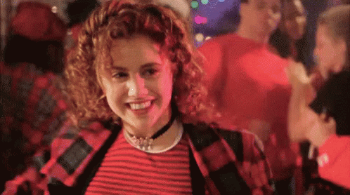 Woman In Red And Black Striped Shirt Smiling