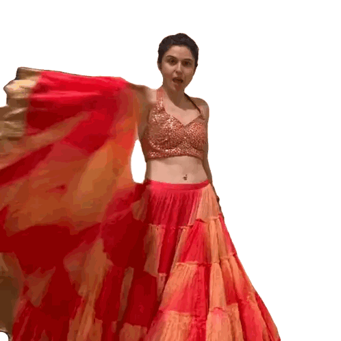 Woman in Red and Orange Skirt and Gold Crop Top