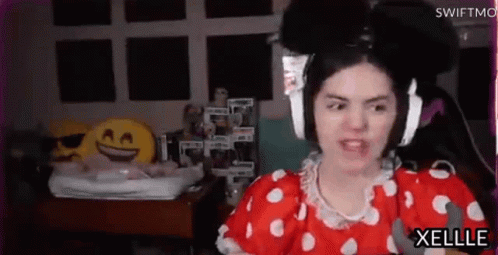 Woman In Red And White Polka Dot Dress Wearing Headphones GIF