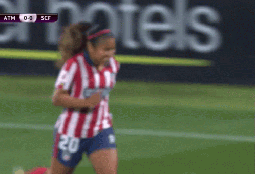 Woman in Red and White Striped Shirt Number 20
