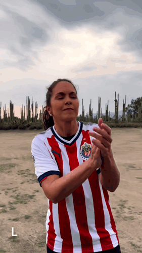 Woman in Red and White Striped Shirt with L