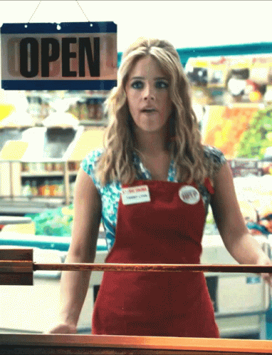 Woman in Red Apron With Open Sign