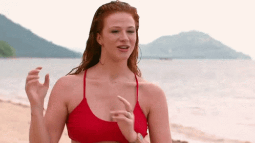 Woman in Red Bikini Standing on Beach