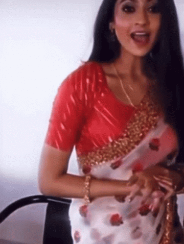 Woman in Red Blouse and White Saree