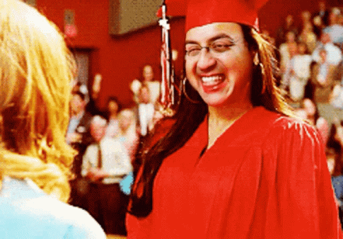 Woman in Red Cap and Gown Smiling