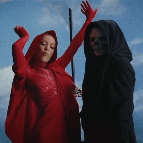 Woman In Red Cape And Grim Reaper GIF