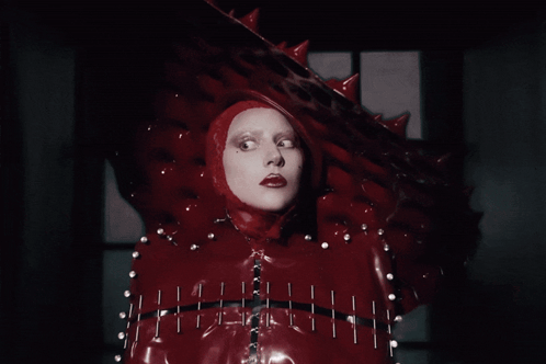 Woman in Red Costume With Head Spikes
