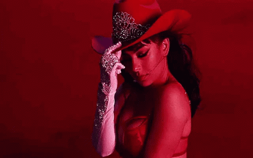 Woman in Red Cowboy Hat and White Gloves