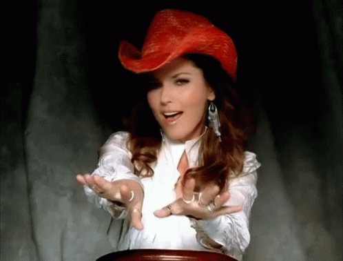 Woman in Red Cowboy Hat and White Shirt