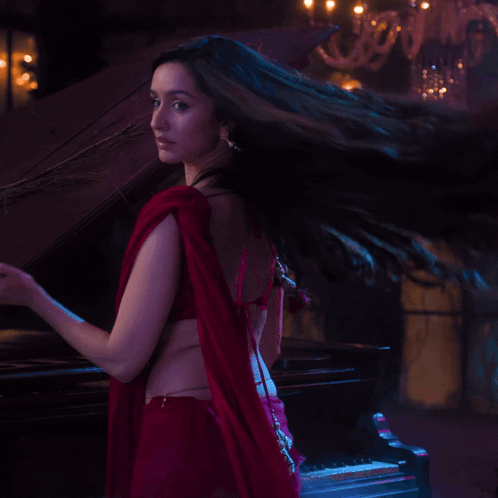 Woman in Red Crop Top and Red Saree