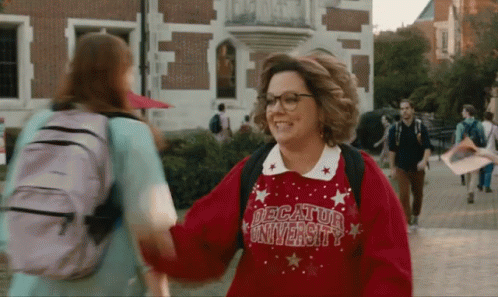 Woman in Red Decatur University Sweater Shaking Hands