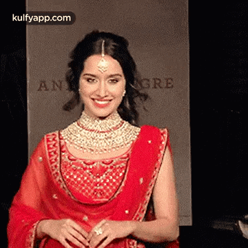 Woman in Red Dress and Jewelry Smiling