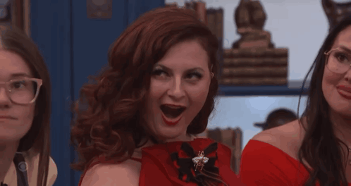 Woman in Red Dress and Red Gloves With Mouth Open