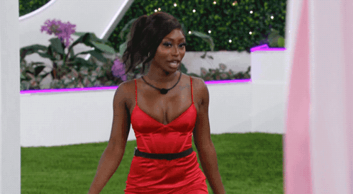 Woman In Red Dress By Pink Curtain GIF