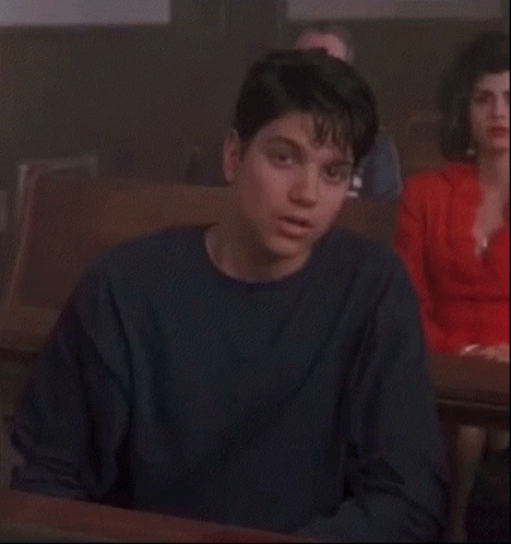 Woman In Red Dress Courtroom Hand On Face GIF
