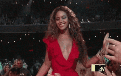 Woman in Red Dress Dancing Crowd MTV Logo