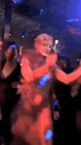 Woman In Red Dress Dancing In Club GIF