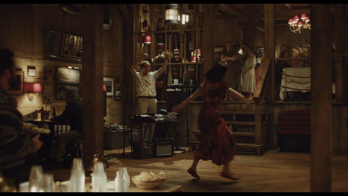 Woman In Red Dress Dancing In Wooden Room GIF