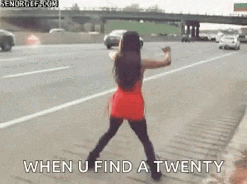 Woman in Red Dress Dancing on Highway
