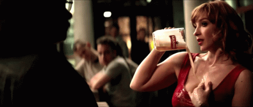 Woman In Red Dress Drinking Bohemia Bottle GIF